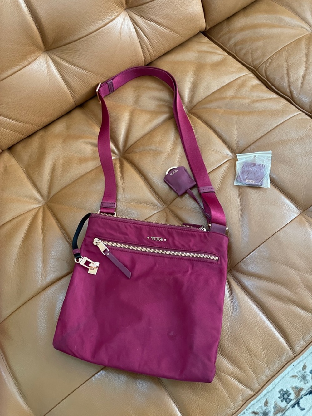 Tumi Women's Crossbody Bag - Berry Plum with Gold Hardware